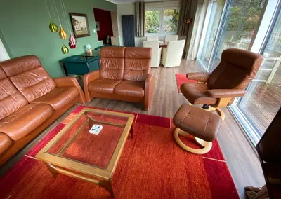 an overhead view of a living room with leather furniture at Westwood - The B&B with a view in Cockermouth