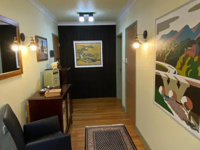 a hallway with a desk and a chair in a room at Westwood - The B&B with a view in Cockermouth