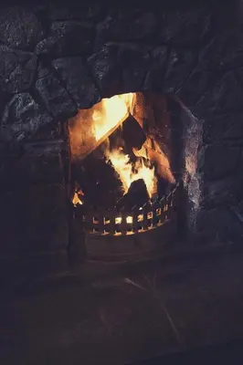 a brick oven with a fire inside of it at The Bridge Inn in Holmrook