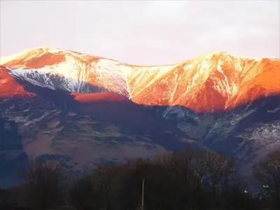 a view of a mountain with snow on it at Acorn Lodge - Burnside Park in Keswick