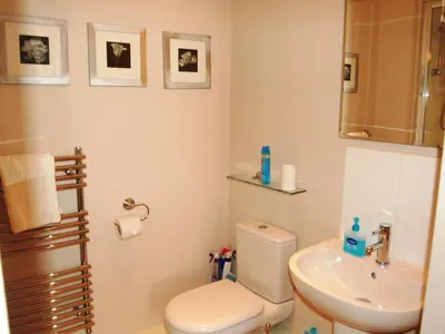a bathroom with a toilet and a sink at Brundholme in Keswick