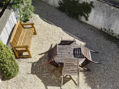 two wooden chairs and a table and two chairs at Carthwaite in Keswick