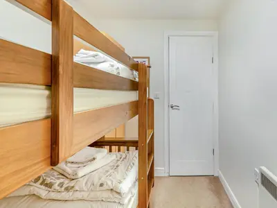 a couple of bunk beds in a room at Kissing Gate in Keswick