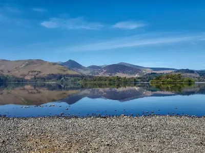 a view of a lake with mountains in the background at Lavender Cottage in Keswick