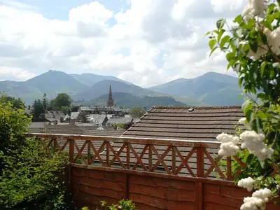 a view of a town with mountains in the background at Peel Wyke in Keswick