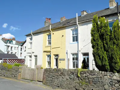 a row of houses on the side of a street at 14 Greta Villas in Keswick