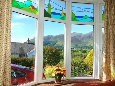 a window with a view of the mountains at Bracken Howe in Portinscale