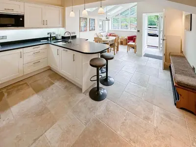 a kitchen with a island in the middle of a room at Brasscam in Rosthwaite