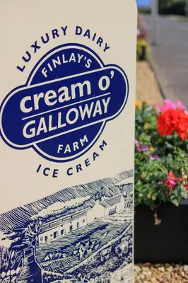 a sign for a creamery called ice cream clawagency at The Farmers Inn in Dumfries