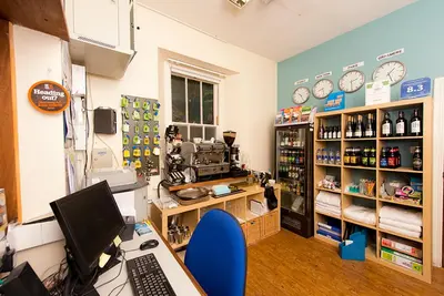 a room with a desk with a computer in it at YHA Grasmere Butharlyp Howe in Grasmere