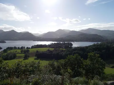 a view of a lake with mountains in the background at Swiss Court Guest House in Keswick