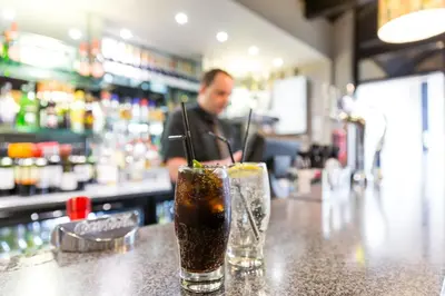 a drink sitting on top of a bar at Trout Hotel in Cockermouth