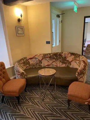 a living room with a couch and two chairs at Royal Oak Hotel in Rosthwaite