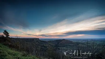 a view from the top of a hill at sunset at Red Rose Cottage in Cockermouth