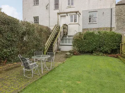 a table and chairs in the backyard of a house at 79 Laurel Bank in Gatehouse of Fleet