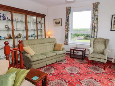 a living room with a couch and a chair at West Croft in Mawbray