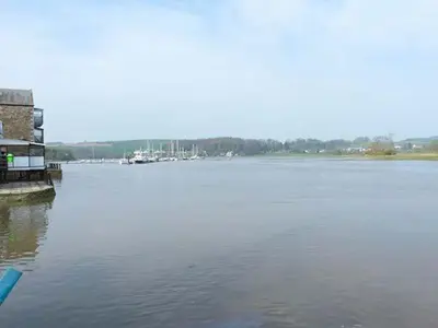 a view of a large body of water with a building at Fish House in Kirkcudbright
