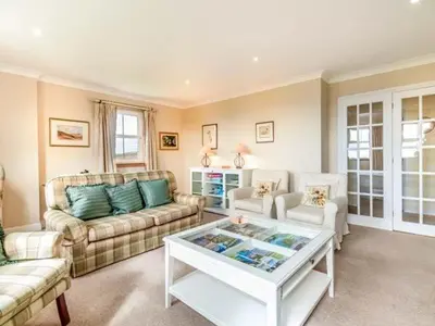 a living room with a couch and a coffee table at Little Laight in Cairnryan