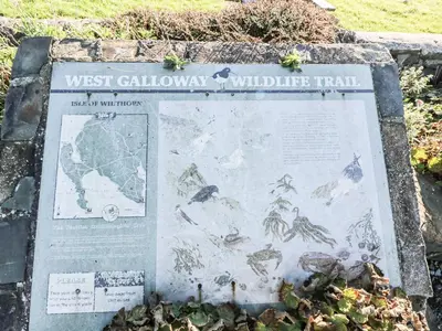a sign for the west caledonian wildlife trail at The Pink House in Isle of Whithorn