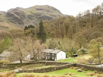 a large house in the middle of a field at Littlebeck in Rosthwaite