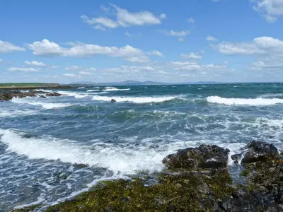 a view of the ocean with waves hitting the rocks at Torkeld Holiday Cottage in Garlieston