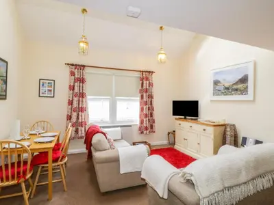 a living room with a couch and a table at Castlerigg in Keswick