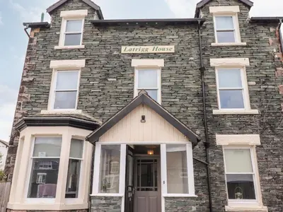 a brick building with a sign that reads turtles lunch at Latrigg House in Keswick