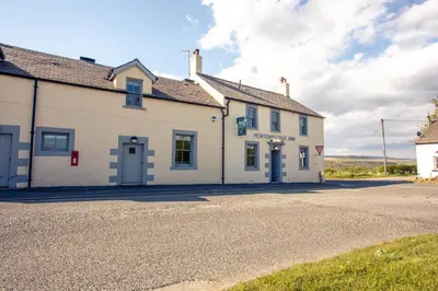a white building on the side of a road at Pentonbridge Inn - Restaurant with Rooms in Carlisle