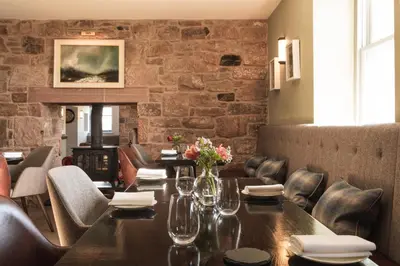 a dining room with a table and chairs at Pentonbridge Inn - Restaurant with Rooms in Carlisle