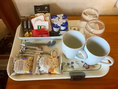 a tray with two cups of coffee on a table at Ferintosh Guest House in Dumfries