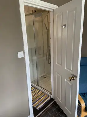 a walkin shower in a bathroom with a glass door at No 4 Portpatrick B&B in Portpatrick
