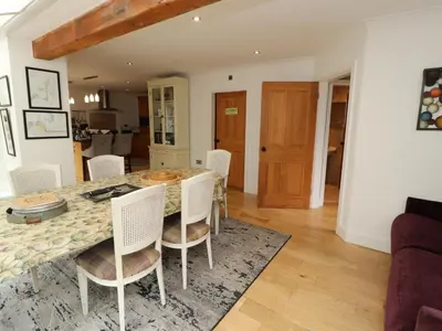 a kitchen and dining room with a table and chairs at North Lodge in Annan
