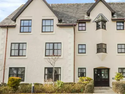 a large white house with black windows at Andra Ghyll in Keswick