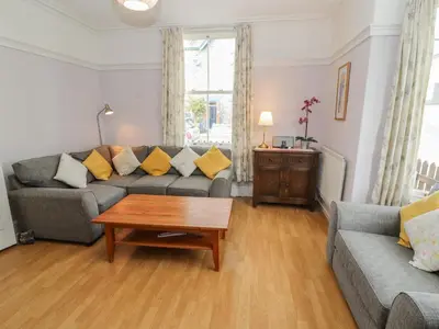 a living room with a couch and a coffee table at Pelham House in Keswick