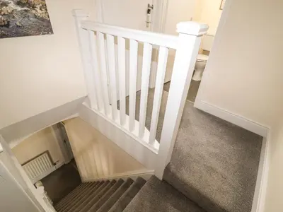 a stairwell with a floor drain in the middle at Pelham House in Keswick