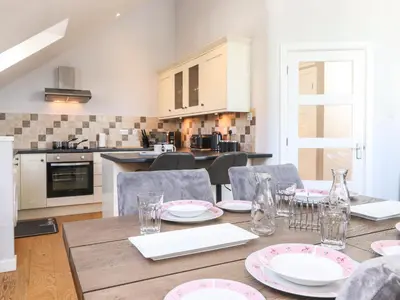 a kitchen and dining room with a table and chairs at Sky View in Keswick