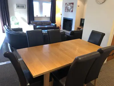 a conference room with a wooden table and chairs at Irton Hall in Eskdale