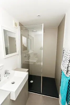 a bathroom with a glass shower and a sink at Jack's Hideaway in Gatehouse of Fleet