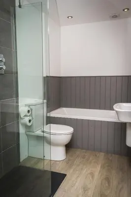 a bathroom with a toilet and a sink at Woolpack Inn in Eskdale