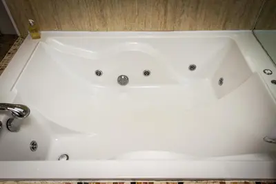 a white bath tub in a bathroom at Woolpack Inn in Eskdale