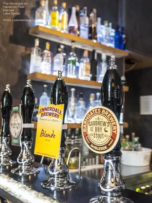 a group of bottles of beer on a bar at Woolpack Inn in Eskdale