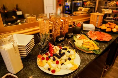 a table with a plate of food on a counter at Halvard Hotel in Douglas