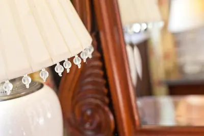 a close up of a lamp with a reflection in a mirror at Bridge Hotel in Buttermere