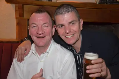 two men posing for a picture with a beer at Creebridge House Hotel in Newton Stewart