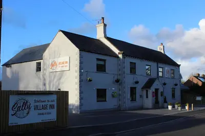 a white building on the side of a street at The Sally in Carlisle