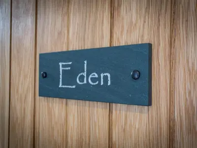 a sign on a wooden door with the word dean at The Sally in Carlisle