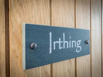 a sign on a wooden wall with the word hiring at The Sally in Carlisle