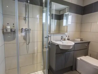 a bathroom with a shower and a sink at The Sally in Carlisle