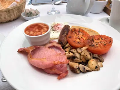 a plate of food with meat potatoes and mushrooms at The Waterfront in Portpatrick
