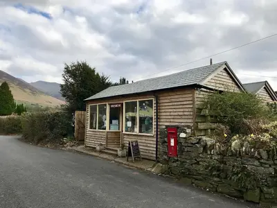 a small house on the side of a road at Melbreak in Lorton